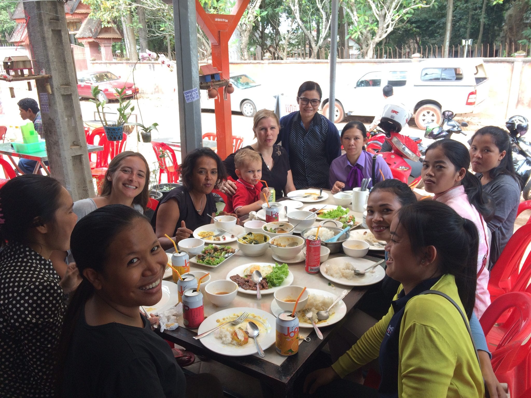 Cambodian women and volunteer at lunch